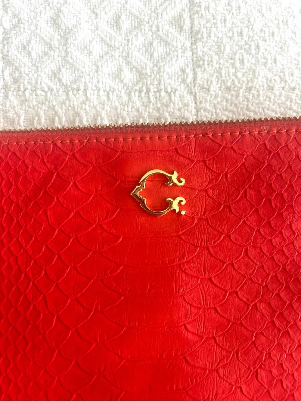 C. Wonder Clutch Orange Red Embossed Print Zip Close with Gold C Emblem